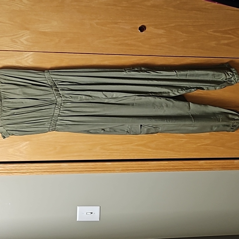 Army Green sleeveless jumpsuit with matching waist tie. Size XL